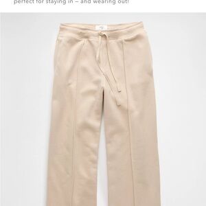 Cream colored sweat pants with Elastic Waistband and Relaxed Fit